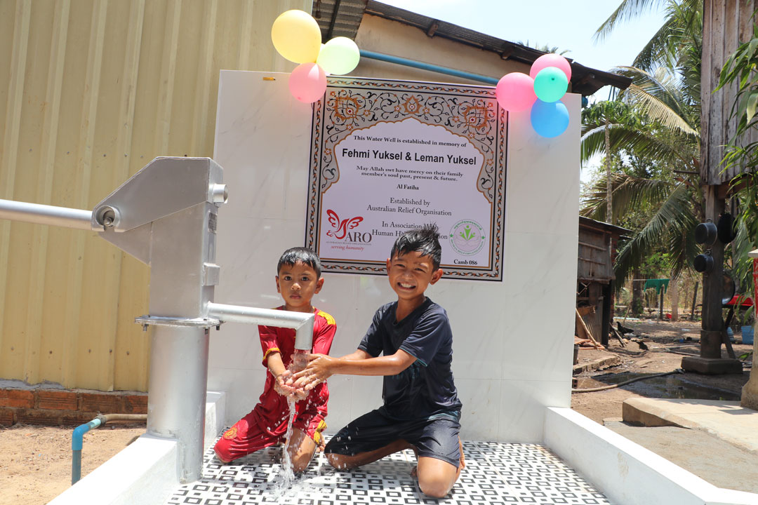 Kids enjoys playing water from our well 086 in Tboung Khmum Province